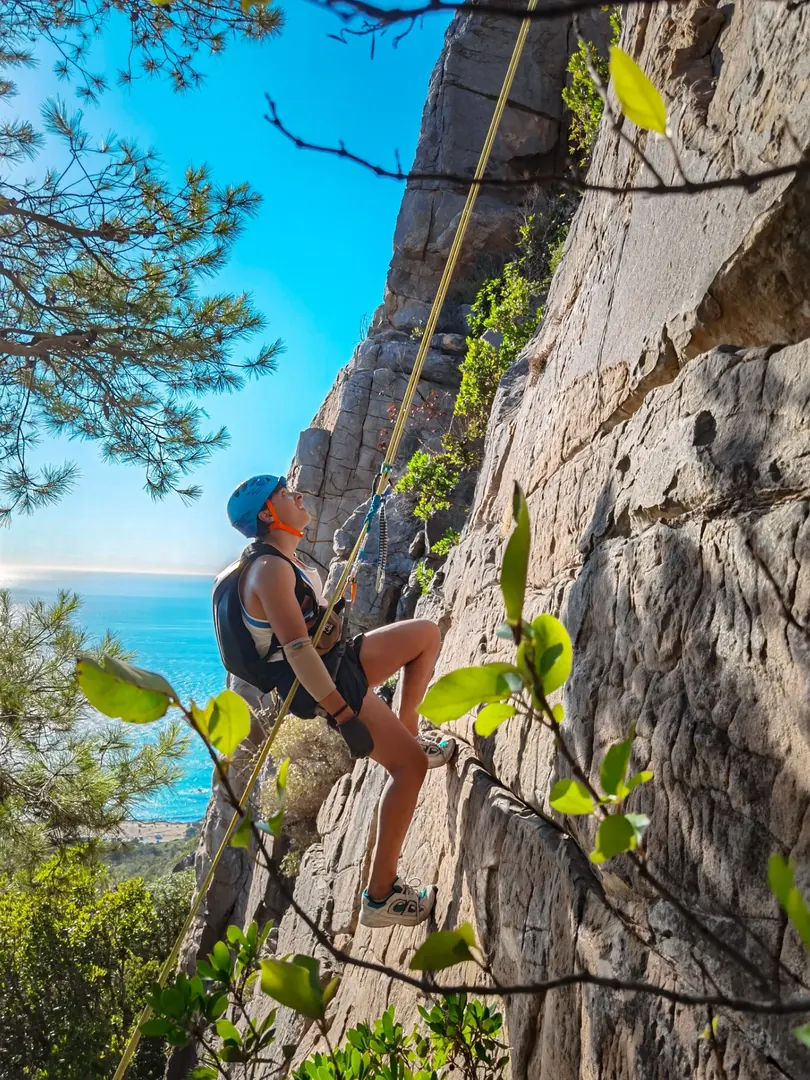 Rock climber at Cap Spartel with Mediterranean sea view, Tangier Morocco